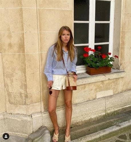 French influencer Monica de La Villardière bringing Parisian style to shorts and a button down