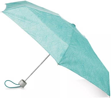 A light blue totes NeverWet Mini Folding Umbrella with floral print on top of a silver shaft and a blue strap
