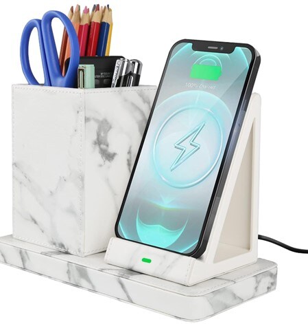 A white marble wireless charger with small desk organizer