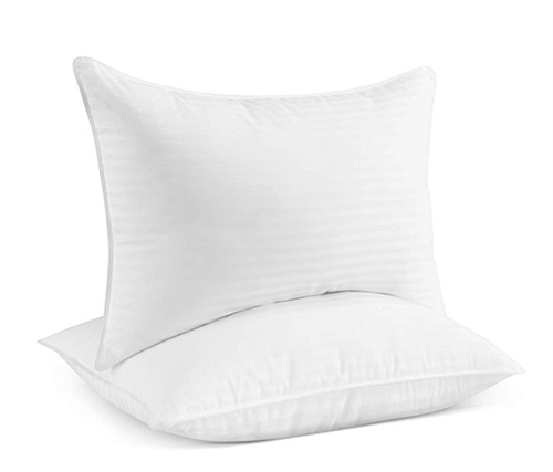 Two white pillows one on top of the other