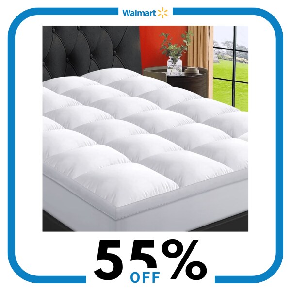 A white mattress topper on a mattress