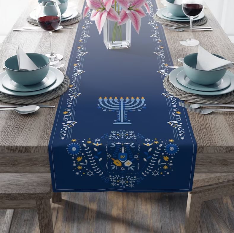 blue hanukkah table runner with image of a menorah