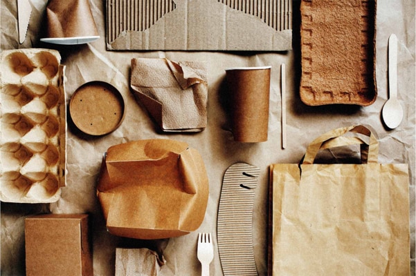 Different sorts of paper packaging laid on a table
