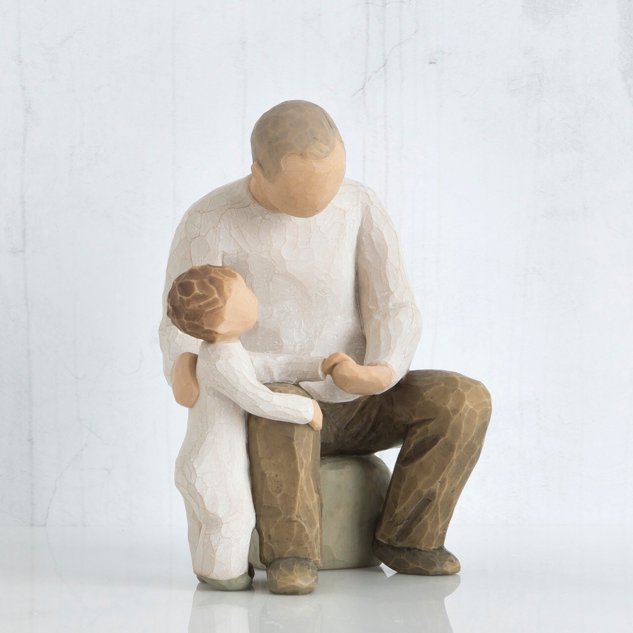 willowtree figurine of a male figure with a small child to represent the bond of a grandfather and grandchild