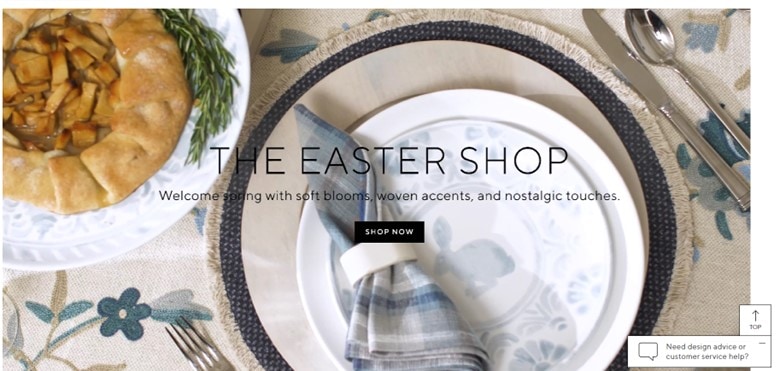 A screenshot of Pottery Barn’s Eastern Shop Sale page displaying a set table with white and blue plates and appliances, and a pie in the upper left corner