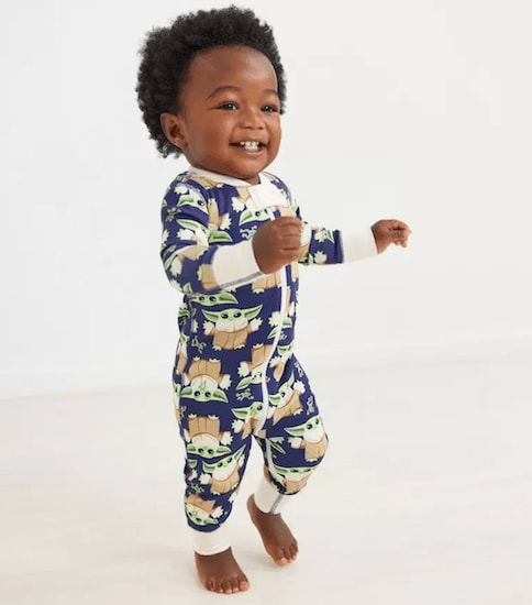 A child wearing blue and white Baby Star Wars Grogu Sleeper in Organic Cotton 