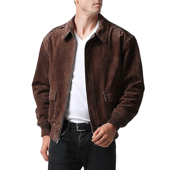 A man wearing a Brown Landing Leathers Men Air Force A-2 Suede Leather Flight Bomber Jacket, a white shirt, and black jeans