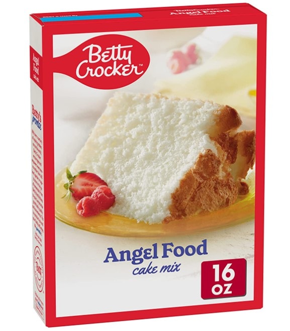 A classic Betty Crocker 16oz Angel Food cake mix box displaying a piece of cake and a cut strawberry in the center and a red frame around it