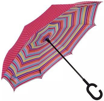A pink with white polka dots and a rainbow Shedrain Unbelievabrella Reversible Dual Print Umbrella with black C-shaped rubber coated handle.