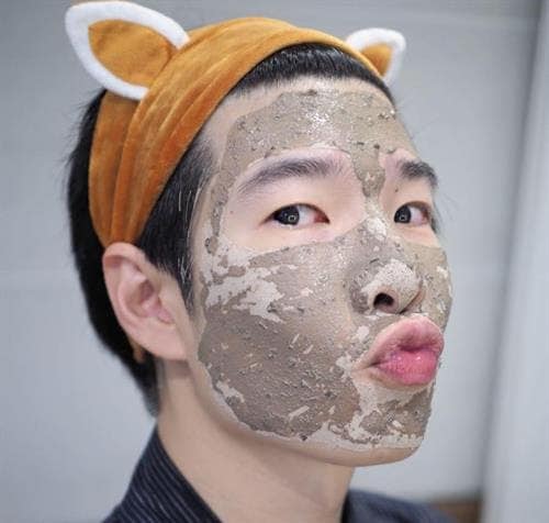 Thai influencer PuPe wearing a facial mask and a headband with animal ears