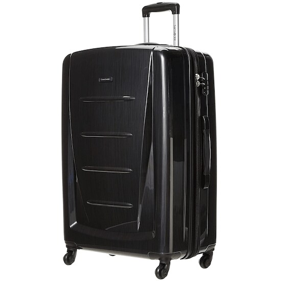 A 28-inch Brushed Anthracite Samsonite Winfield 2 Hardside Checked-Large Luggage with silver zippers and four multidirectional spinner wheels.