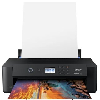 A black Epson Expression Photo HD XP-15000 Wide-Format Printer with a stack of paper and a printed photo