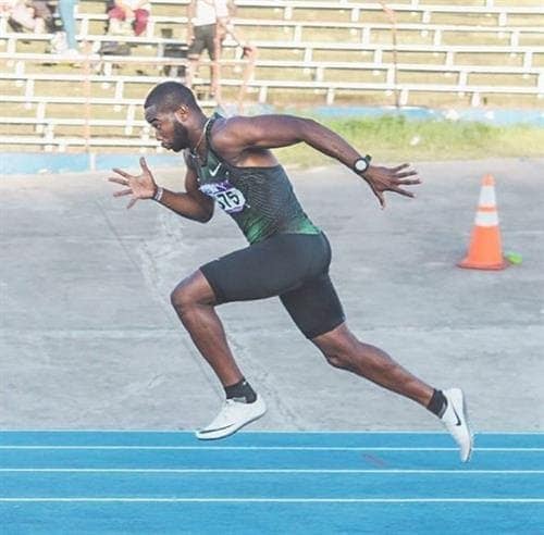 World Championship Relay Medalist and influencer Delano Williams sprinting on the track