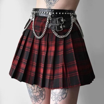  Tattooed model wearing the red and black checkered pleated skirt with black belts with chains