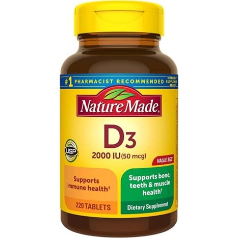A yellow bottle of Nature Made’s D3 tablets with a dark yellow label on the right that reads “Supports Immune Health” and “220 talets” and a green label that reads “Supports bone, teeth & muscle health” and “Dietary Supplement” on the right