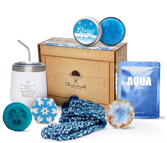 Charmed Crates wooden box with blue-and-white themed coffee mug, fuzzy socks, face mask, lip balm, etc.