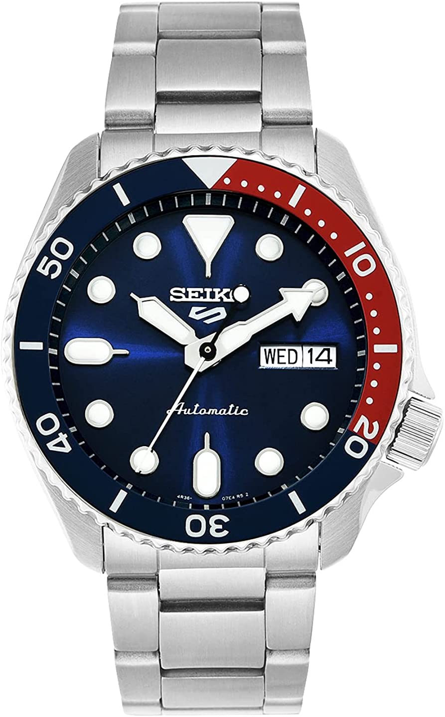 A silver Seiko Men’s Analogue Automatic Watch 5 Sports Blue 3K1 Sport with red and blue details on the bezel and dial 