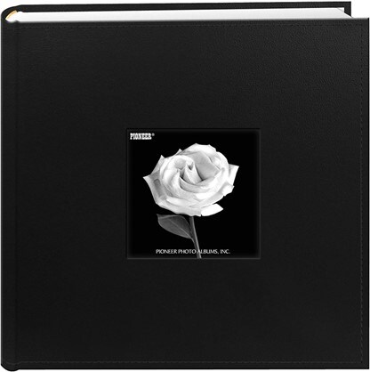 Elegant black photo album with a single white rose in the middle