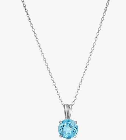 A birthstone pendant necklace featuring a round sky-blue birthstone prong-set in high polished sterling silver.